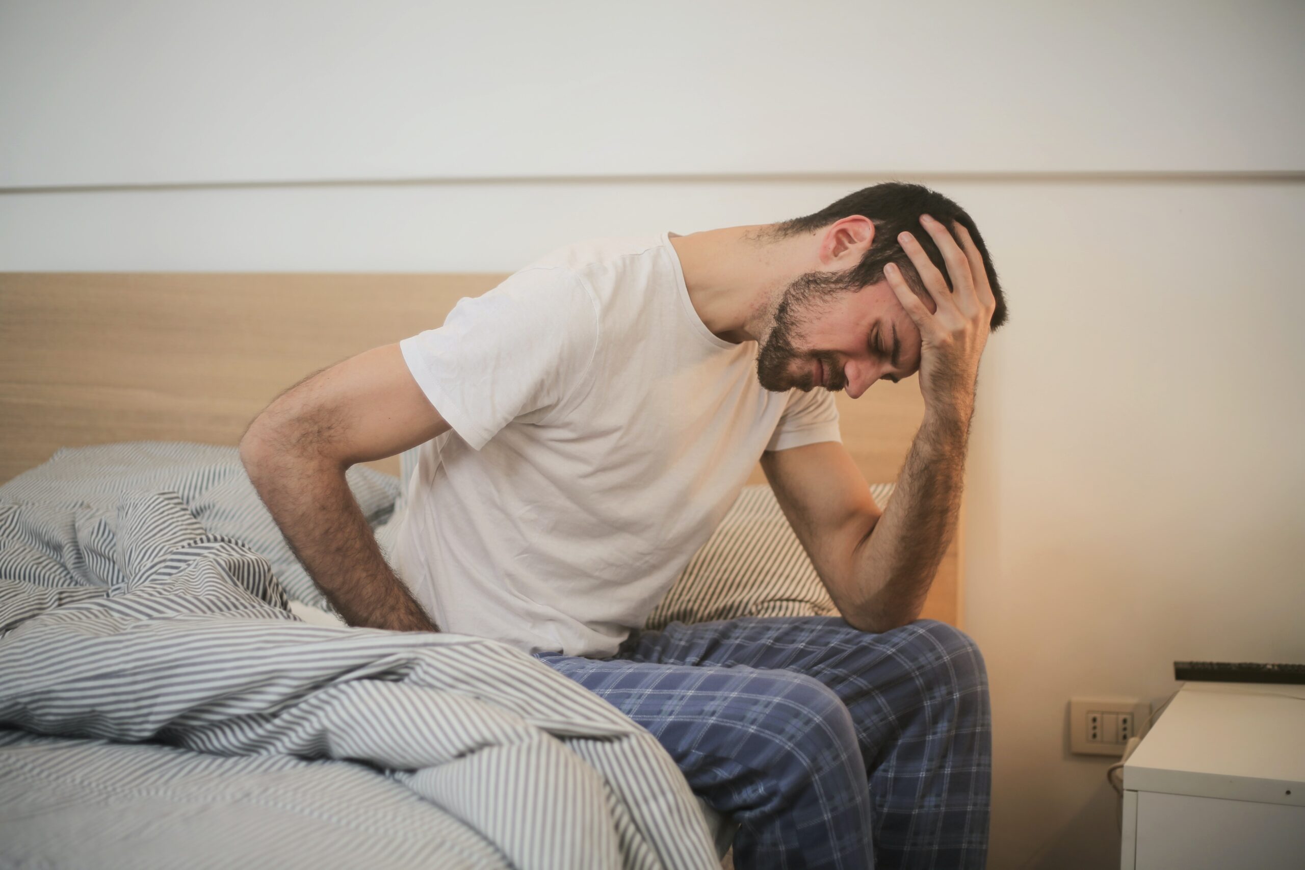 person suffering from migraines upon waking